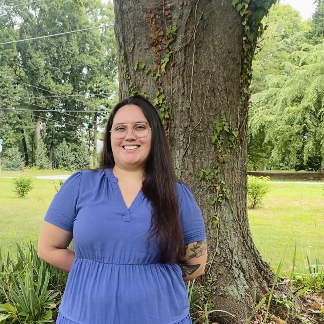 Photo of Jaylynn outside the office.